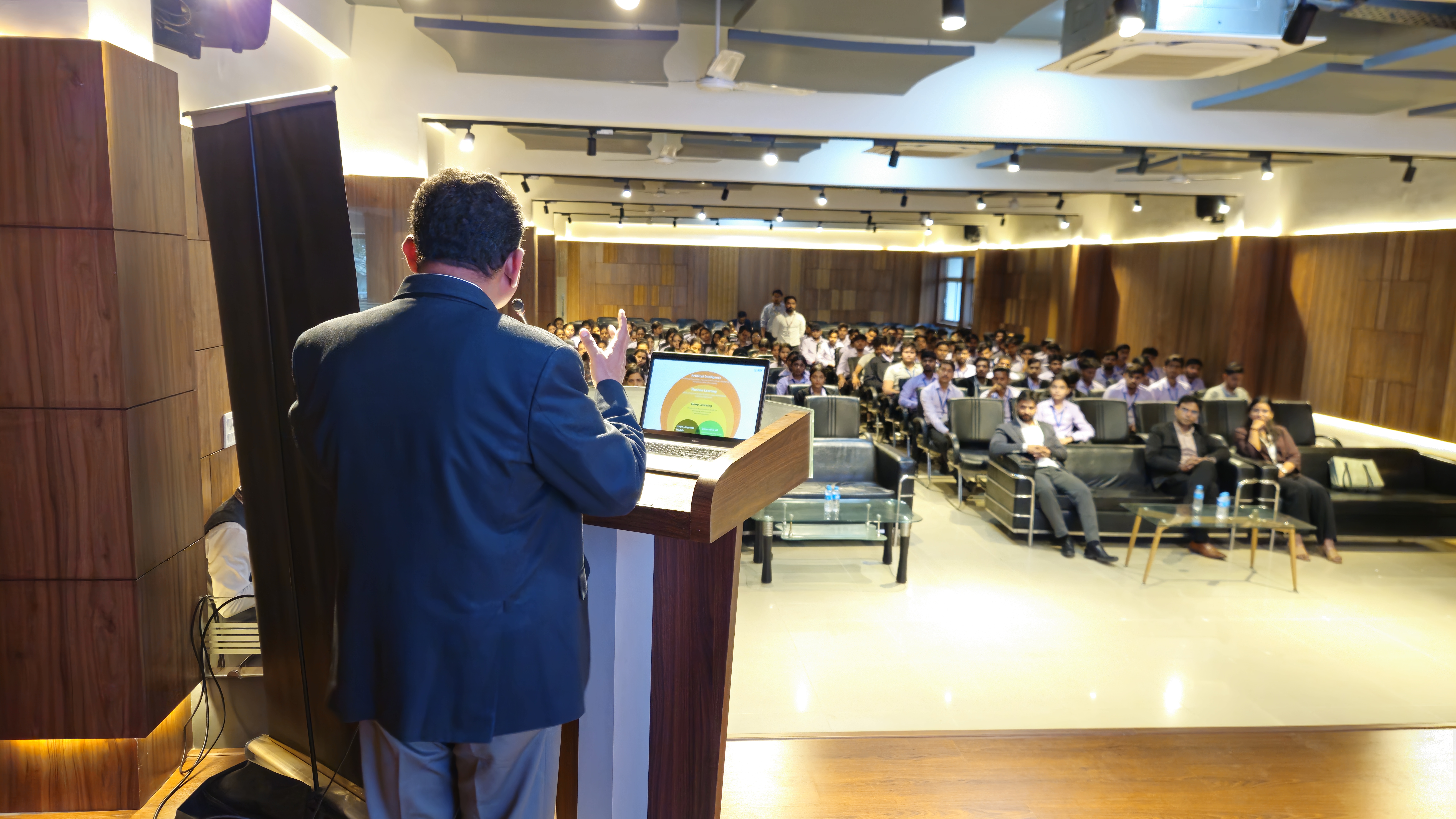 Students raising hands during interactive Q&A